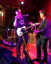 Men Playing The Guitar