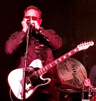 Man Singing with His Guitar